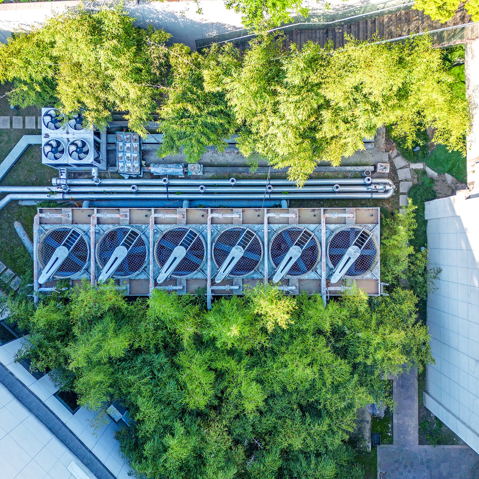 Aerial view of air conditional array in the middle of a building complex.