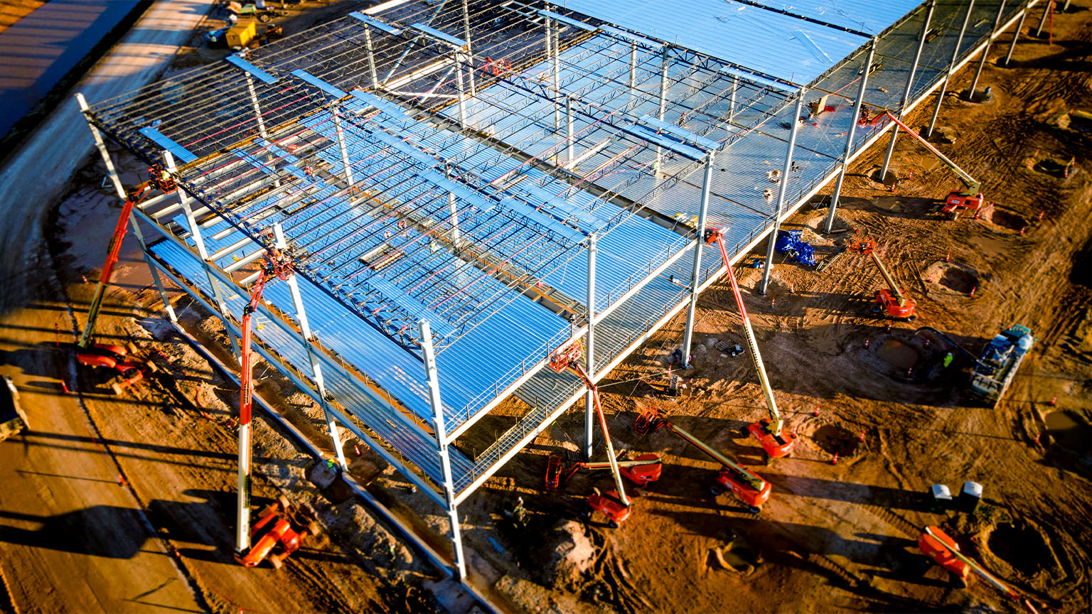Aerial drone view of an electric vehicle battery factory that is under construction 