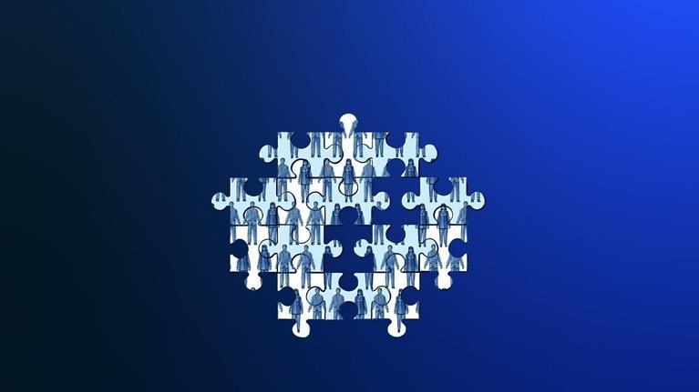 A puzzle consisting of various pieces featuring images of individuals dressed in professional attire. A few pieces are absent, resulting in an unfinished puzzle.