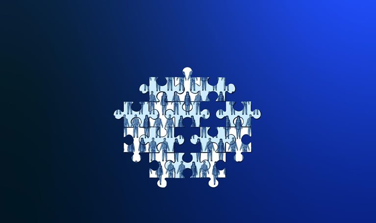 A puzzle consisting of various pieces featuring images of individuals dressed in professional attire. A few pieces are absent, resulting in an unfinished puzzle.