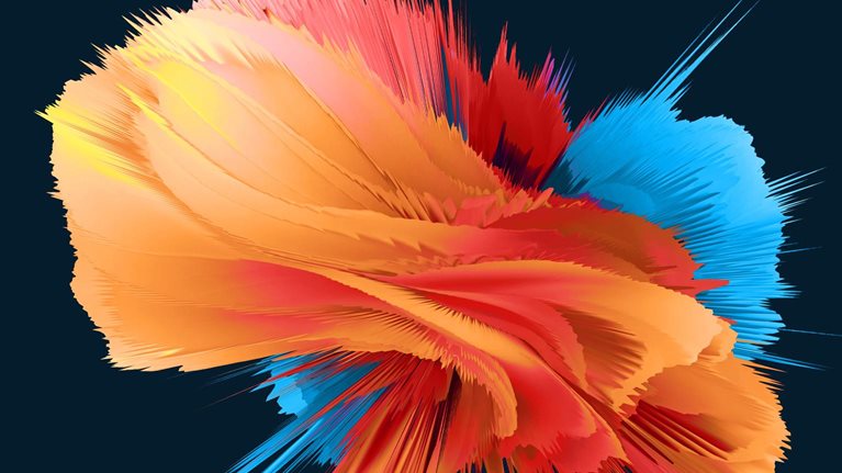 An abstract burst of layered, ribbon-like forms spreads outward in vivid orange, red, yellow, and blue against a dark background.
