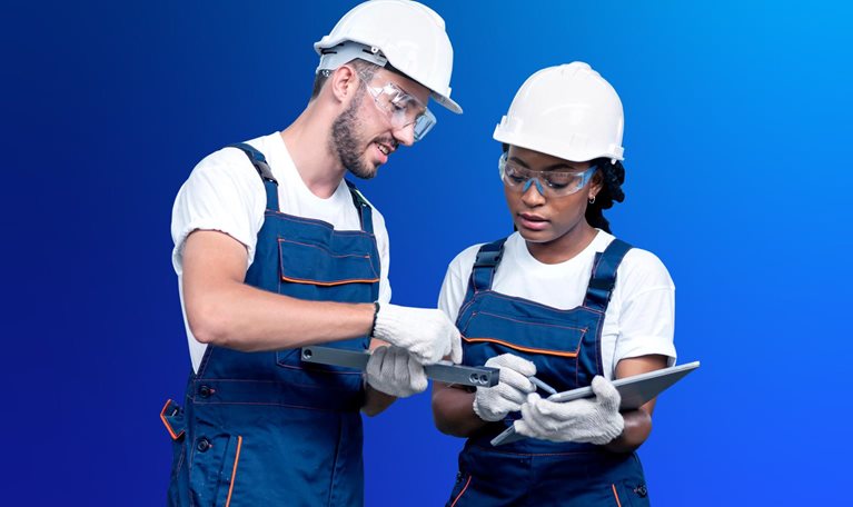 Two production operators with tablet in factory shop floor