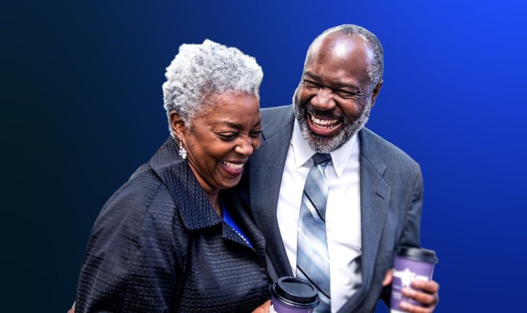 Elderly Black man and woman holding hot beverage tumblers
