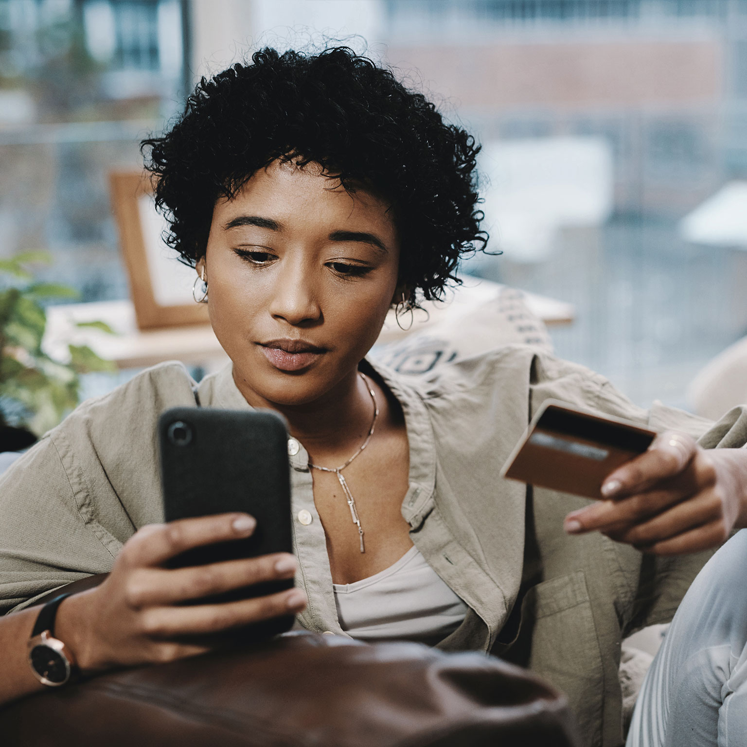 Woman reviewing financing on smart phone