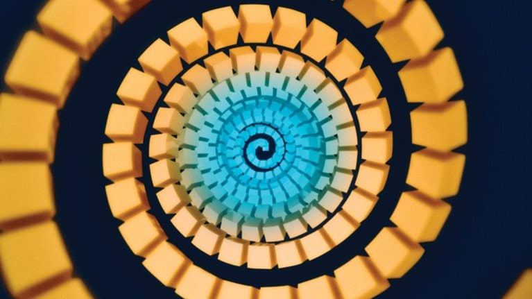 3D render of abstract design of golden stacks spiraling circles