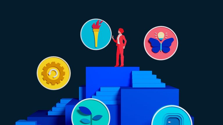 An animation of a female business executive ascending a structure with different sets of steps leading to the top. Along her path to the top, the executive encounters various circular icons, which, after the executive touches them, spin to reveal accompanying images. The icons represent the different stages of the executive’s CEO journey.