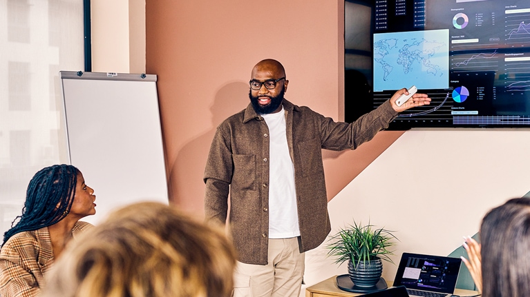 Business team in a meeting with data analysis presentation in a modern office