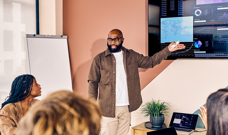 Business team in a meeting with data analysis presentation in a modern office