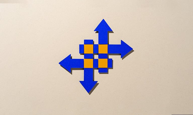 Paper-cut craft featuring four intersecting blue arrows on a beige background, with vibrant orange highlights at the crossover points, symbolizing the idea of merging and transformation