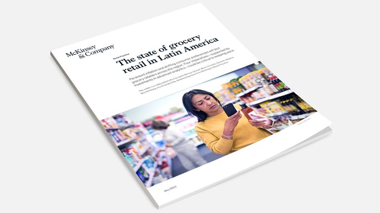 Book image of article image of woman shopper scanning a bottled product with her mobile phone